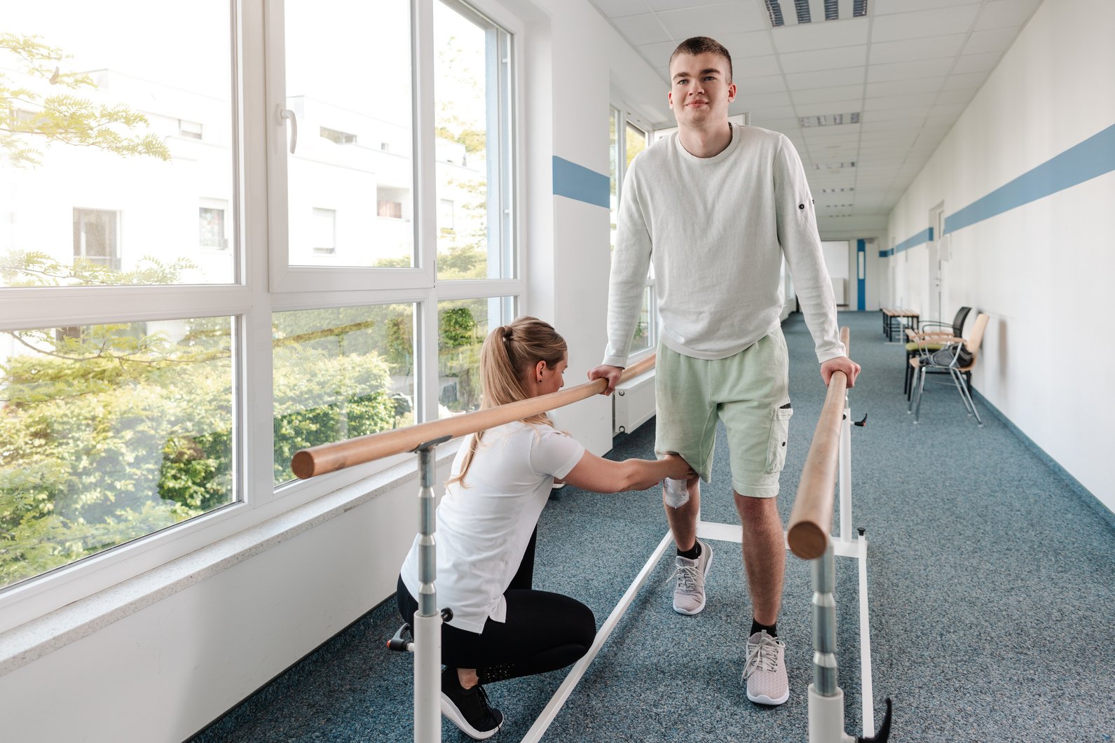 Young Man in Walking Rehabilitation Course after a Sport Injury